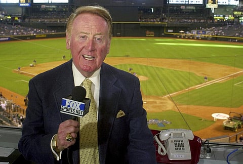 Los Angeles Dodgers television play-by-play announcer Vin Scully rehearses before a baseball game between the Dodgers and the Arizona Diamondbacks in Phoenix (File Photo | AP)