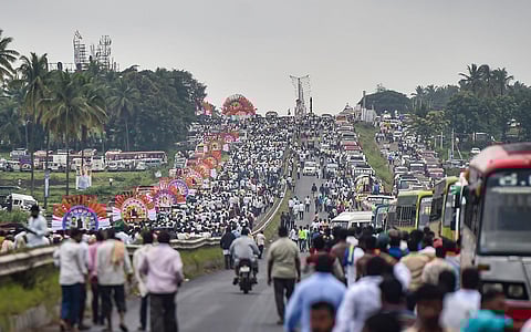 Congress workers and supporters arrive to take part in the 75th birthday celebrations of former Karnataka CM Siddaramaiah, in Davangere, Karnataka, on August 3, 2022. (Photo | PTI)