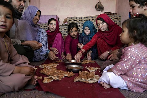 A family eat lunch in their home in one of Kabul's poor neighborhoods in Kabul, Afghanistan. (File Photo | AP)