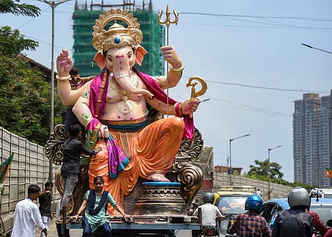 Devotees carry an idol of Lord Ganesh during a procession on the first day of ten-day long 'Ganesh Chaturthi' festival, in Mumbai, Wednesday, Aug. 31, 2022. (Photo | PTI)
