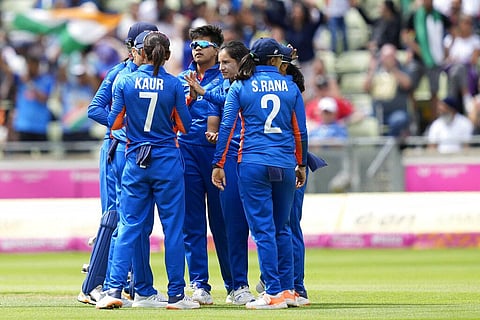 India's Renuka Singh, second right, celebrates with teammates. (Photo | AP)