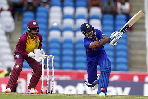 India's Suryakumar Yadav plays a shot to be caught by West Indies' Jason Holder during the first T20 cricket match at Brian Lara Cricket Academy. (Photo | AP)