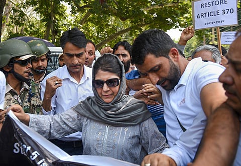 PDP chief Mehbooba Mufti participates in a protest demanding to restore special status of Jammu and Kashmir on the third anniversary of abrogation Article 370 and 35A, on August 5, 2022. (Photo | PTI)