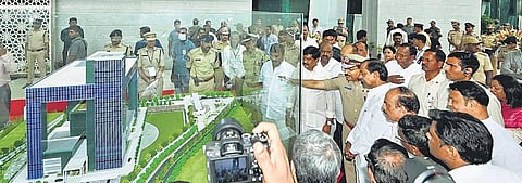 DGP M Mahender Reddy explains the functioning of the ICCC to CM K Chandrasekhar Rao during its inauguration on Monday