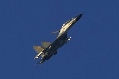 A Chinese J-11 military fighter jet flies above the Taiwan Strait near Pingtan, the closest land of mainland China to the island of Taiwan. (Photo | AP)