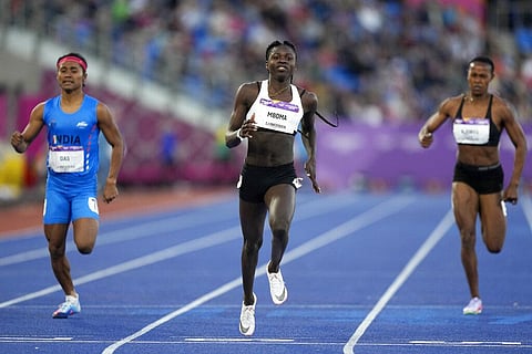 Christine Mboma of Namibia crosses the finish line ahed of Hima Das of India, left, and Rhoda Njobvu of Zambia, right, to win her Women's 200 meters semifinal. (Photo | AP)