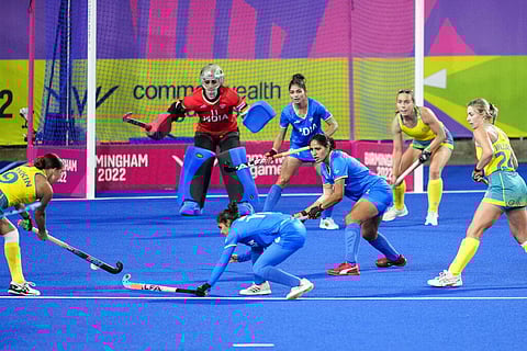 Australia's Shanea Tonkin, left, attempts to score a goal during the women's semifinal hockey match between Australia and India at the Commonwealth Games. (Photo | AP)