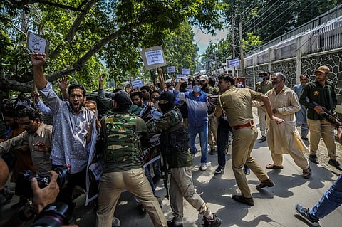 Activists of PDP scuffle with police during a protest marking the anniversary of the revocation of Article 370. (Photo | AP)