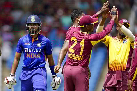 India's Shreyas Iyer leaves the field as West Indies' Akeal Hosein and teammates celebrate his dismissal during the first T20 cricket match. (Photo | AP)