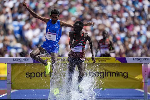 Abraham Kibiwot, of Kenya right, leads Avinash Mukund Sable of India competes in the men's 3000 meters steeplechase final. (Photo | PTI)