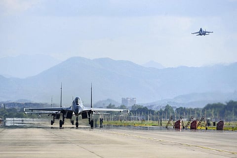 Air force and naval aviation corps of the Eastern Theater Command of the Chinese People's Liberation Army (PLA) fly planes at an unspecified location in China. (Photo | AP)