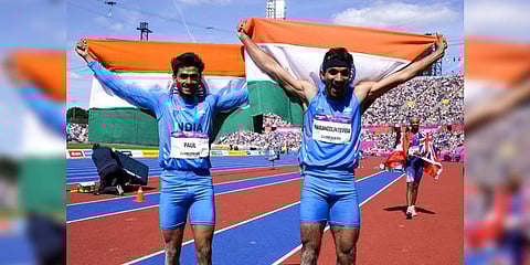 Gold medal winner Eldhose Paul, left, and compatriot and silver medal winner Abdulla Aboobacker celebrate after the men's triple jump final.(Photo | AP)