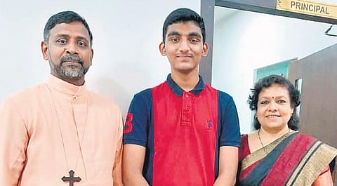 Abhinav, who scored full marks in CBSE Class X exam, with Navajeevan Bethany Vidyalaya principal Shahna Renjith and administrator Fr Daniel Mannil | Express