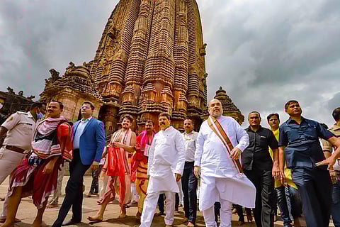 Union Home and Cooperation Minister Amit Shah with Union Education Minister Dharmendra Pradhan visits Lingaraja Temple to offer prayers to Lord Shiva, in Bhubaneswar. (Photo | PTI)