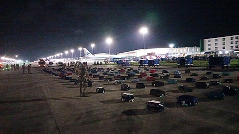 Baggage of passengers being segregated and checked at an isolated spot inside the Bengaluru airport on Sunday night.