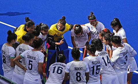 India's captain and goalkeeper Savita, centre talks to her teammates before the start of the games against Canada during the Women's Pool A hockey match. (Photo | AP)