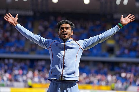Men's triple jump gold medalist Eldhose Paul, of India gestures on the podium during the athletics in the Alexander Stadium at the Commonwealth Games. (Photo | AP)