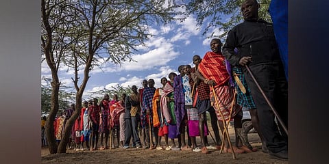 Maasai wait in line to cast their votes in the general election at a polling station in Esonorua Primary School, in Kajiado County, Kenya. (Photo | AP)