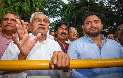 Janata Dal (United) leader Nitish Kumar with Rashtriya Janata Dal leader Tejashwi Yadav interacts with the media after meeting Bihar Governor Phagu Chauhan, in Patna. (Photo | PTI)
