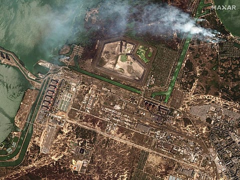 This satellite image provided by Maxar Technologies shows bush fires outside of the main power plant facilities at the Zaporizhzhia nuclear plant in Russian occupied Ukraine.