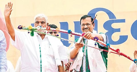 Arvind Kejriwal with BTP founder Chhotu Vasava in South Gujarat. (Photo | EPS)