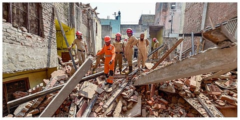 Rescue operation underway after a four-storey under-construction building collapsed in the Azad Market area. (Photo | PTI)