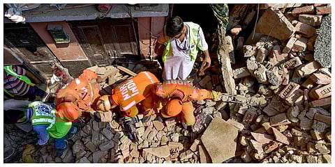 Rescue operation underway after a four-storey under-construction building collapsed in the Azad Market area. (Photo |PTI)
