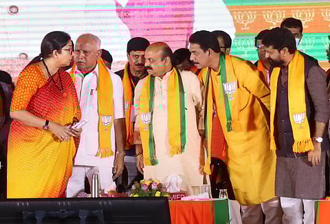 Karnataka CM Basavaraj Bommai with Union Minister Smriti Irani, BJP leader B S Yediyurappa and others during a rally 'Janaspandana'. (Photo | PTI)