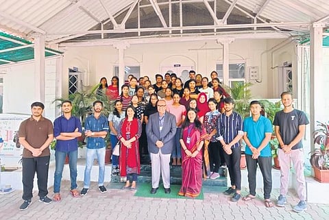 Institute staff with successful students