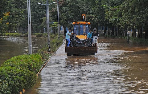 Locals in Bengaluru continued to bear the brunt of severe waterlogging. (Photo | EPS)