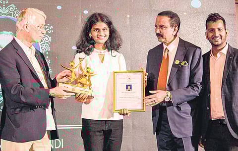 Sir Richard J Roberts presenting the Global Child Prodigy Award to Sharanya Mudundi in Dubai | express