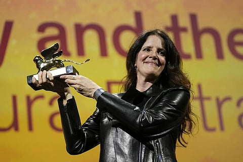 Director Laura Poitras holds the Golden Lion award for best film for 'All the Beauty and the Bloodshed' at the 79th edition of the Venice Film Festival, Italy, Sept. 10, 2022. (Photo | AP)