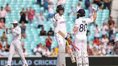 Zak Crawley (left) and Ollie Pope celebrate England's win in the third Test against South Africa. (Photo | AFP)
