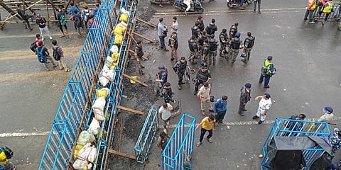 Security personnel stand guard near barricades, put up to stop BJP supporters from taking part in the party's 'Nabanna Abhijan'. (Photo | PTI)