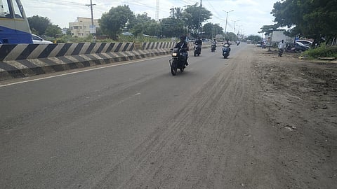 Motorists travel through the sand mounds on the roadside. (Photo | Special Arrangement)