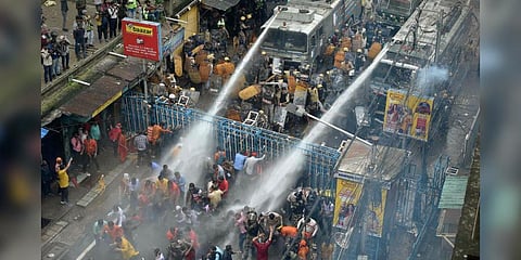 Security personnel use water cannons to disperse BJP supporters during their 'Nabanna Abhijan' (March to Secretariat) to protest against alleged corrupt practices of TMC govt in Howrah. (Photo | PTI)