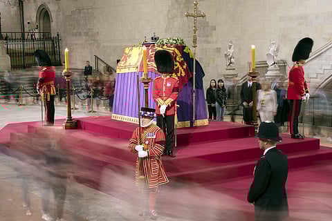 Members of the public file past the coffin of Queen Elizabeth II lying in state on the catafalque in Westminster Hall at the Palace of Westminster in London on September 15, 2022. (Photo | AFP)