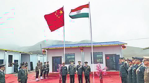 The Indian Army and Chinese PLA personnel standing in front of the Bumla BPM Hut before the meeting, October 1, 2019
