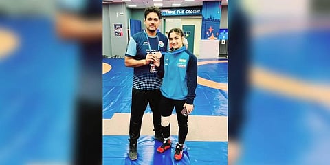 Vinesh Phogat with women's wrestling team head coach Jitendra Yadav in Belgrade. (Photo | Express)
