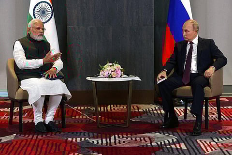 Russian President Vladimir Putin, right, listens to Indian Prime Minister Narendra Modi during their talks on the sidelines of the SCO Summit. (Photo | AP)