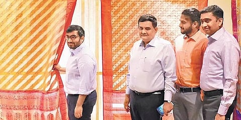 RmKV officials displaying the new collections at the event | Karthik Saran