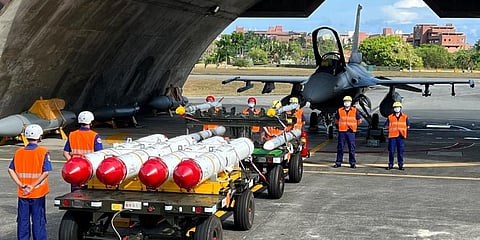 Military personnel stand next to U.S. Harpoon A-84, anti-ship missiles and AIM-120 and AIM-9 air-to-air missiles prepared for a weapon loading drills at Hualien Airbase in Taiwan. (Photo | AP)