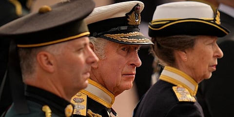 King Charles III and Princess Anne follow the coffin of Queen Elizabeth II as it is pulled after her funeral service in Westminster Abbey, in central London. (Photo | AP)