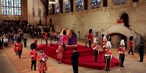The King's Body Guard, formed of Gentlemen at Arms, Yeomen of the Guard and Scots Guards, change guard duties around the coffin of Queen Elizabeth II. (Photo | AP)