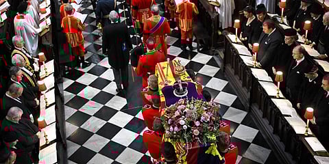 The coffin of Queen Elizabeth II, draped in the Royal Standard, is placed in Westminster Abbey in central London, for the funeral service, Monday Sept. 19, 2022.(Photo | AP)