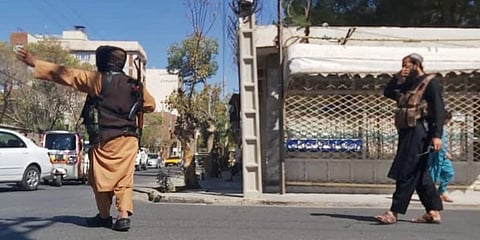 Taliban fighters block a road after a blast during the Friday prayer in Gazargah mosque, in Herat on September 2, 2022. (Photo |AFP)