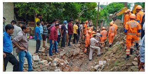National Disaster Response Force (NDRF) personnel during a rescue operation after a portion of a boundary wall of a housing society collapsed, at Jal Vayu Vihar in Noida. (Photo | PTI)