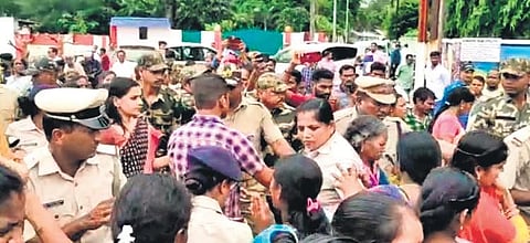 Villagers trying to gherao Rayagada Collector Swadha Dev Singh on Monday | Express