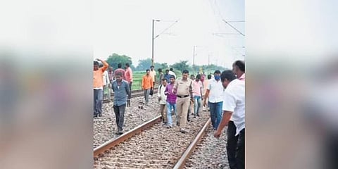 Police inspect the accident spot near Kothapalli railway station in Peddapalli district on Tuesday.
