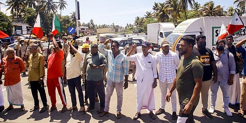 Activists of Popular Front of India (PFI) block Kazhakootam - Kovalam bypass during their protest against the raid by NIA.(Photo | PTI)